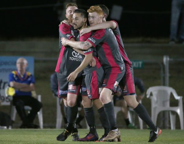 Heidelberg United players celebrate.
