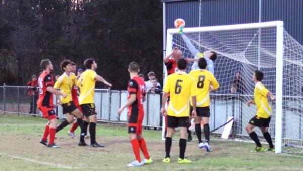 Sunshine Coast Fire goalkeeper Sam Nickolls tips over the bar in Sunday's 5-1 win over Redlands United at Cleveland Showgrounds