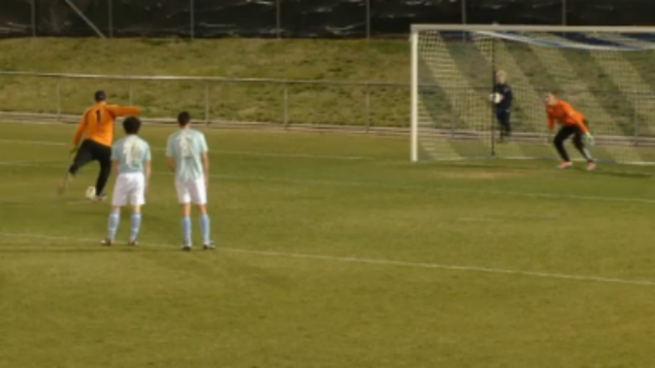 Canberra Olympic's Angelo Konstantinou lines up a penalty against Belconnen United's Adam Perakovic.