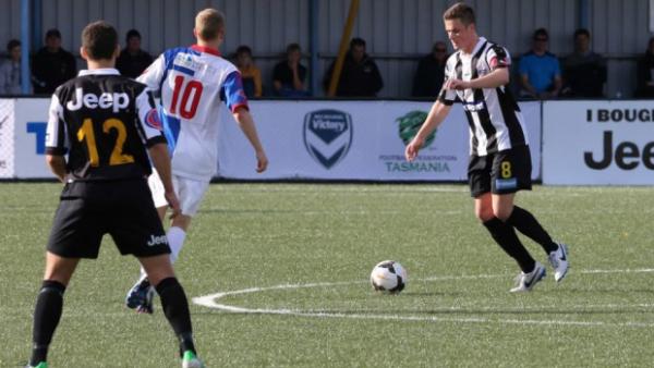 Players in action from Tasmania's Victory League.