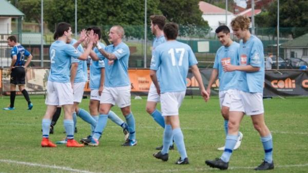 Mark Doninger is congratulated by team mates after one of his five goals.