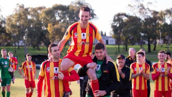 David Menechella is chaired off in his final game.
