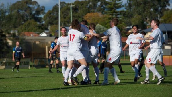 Cockburn City players celebrate.