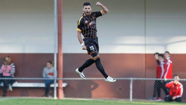 Perry Mitris celebrates one of his two goals for MetroStars.