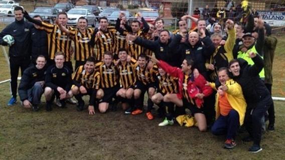 The Cooma Tigers celebrate winning Capital Football's NPL title.